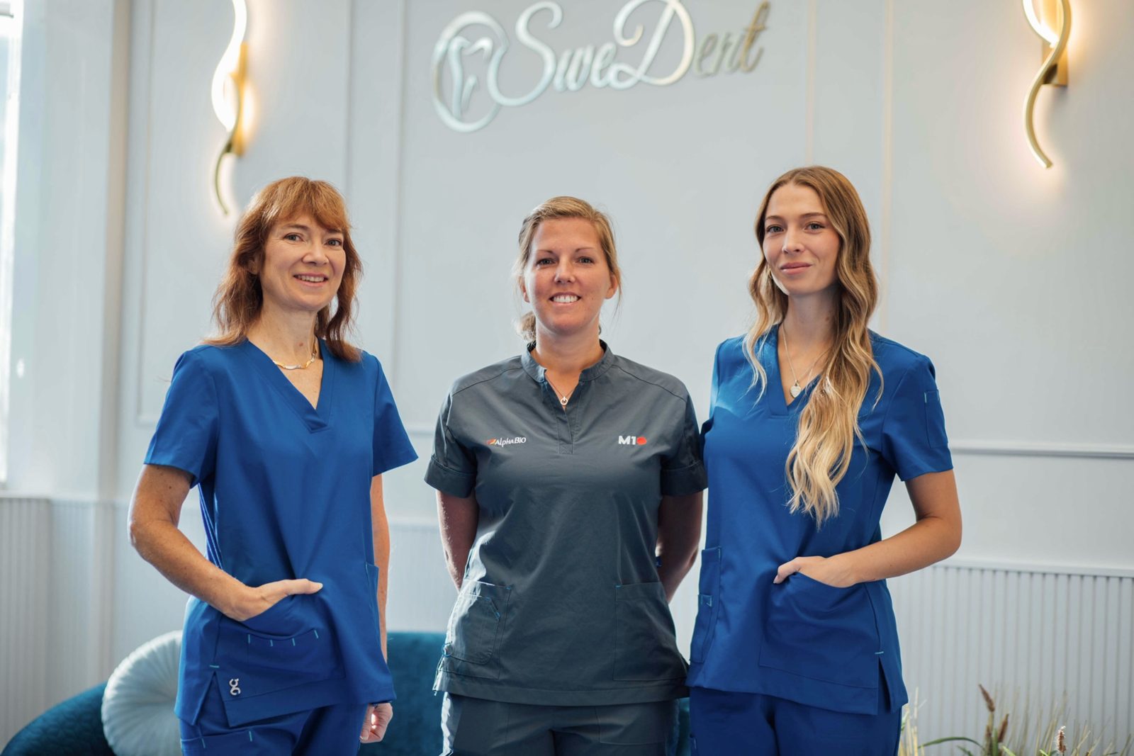 Linda, centre, with two colleagues in the reception area of SweDent dental clinic in La Zenia